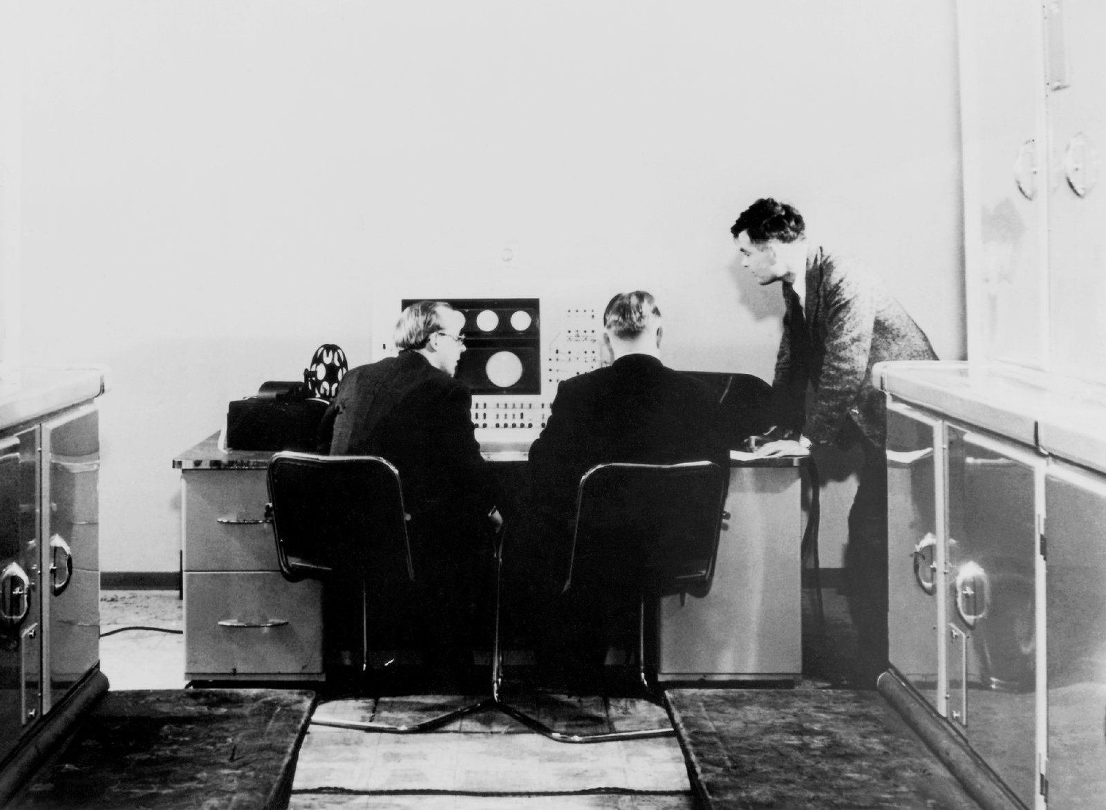Alan Turing and colleagues at work on the Ferranti Mark I Computer in the UK in 1951. Photo from the Science & Society Picture Library via Getty Images.