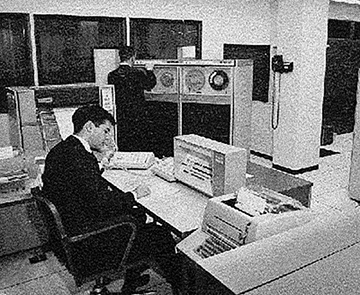 Working at the hub of an SDS-940 in 1966. Image from Rick Crandall.