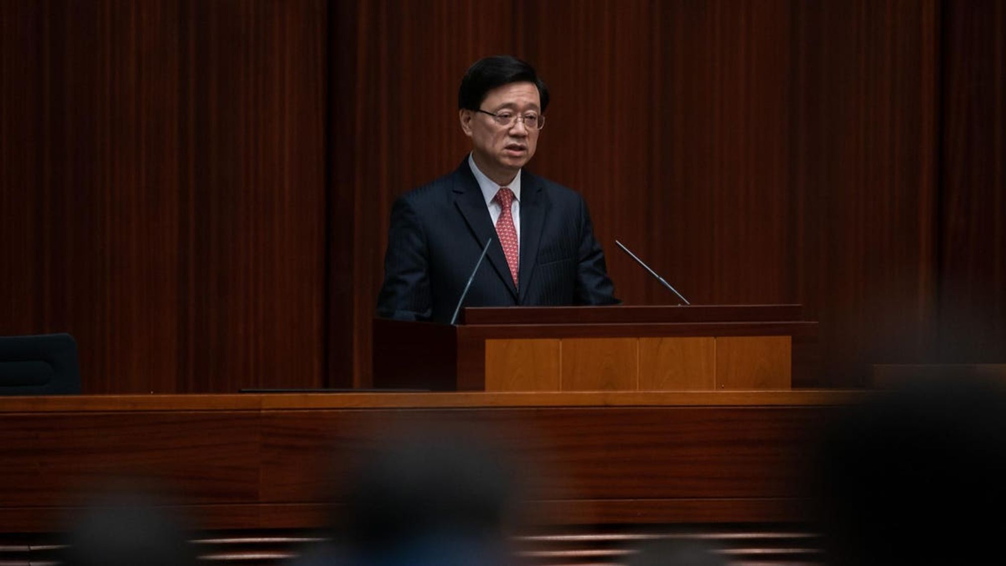 Hong Kong Leader Unveils Battle Plan To Win Talent War, Prioritizes Security In Policy Address