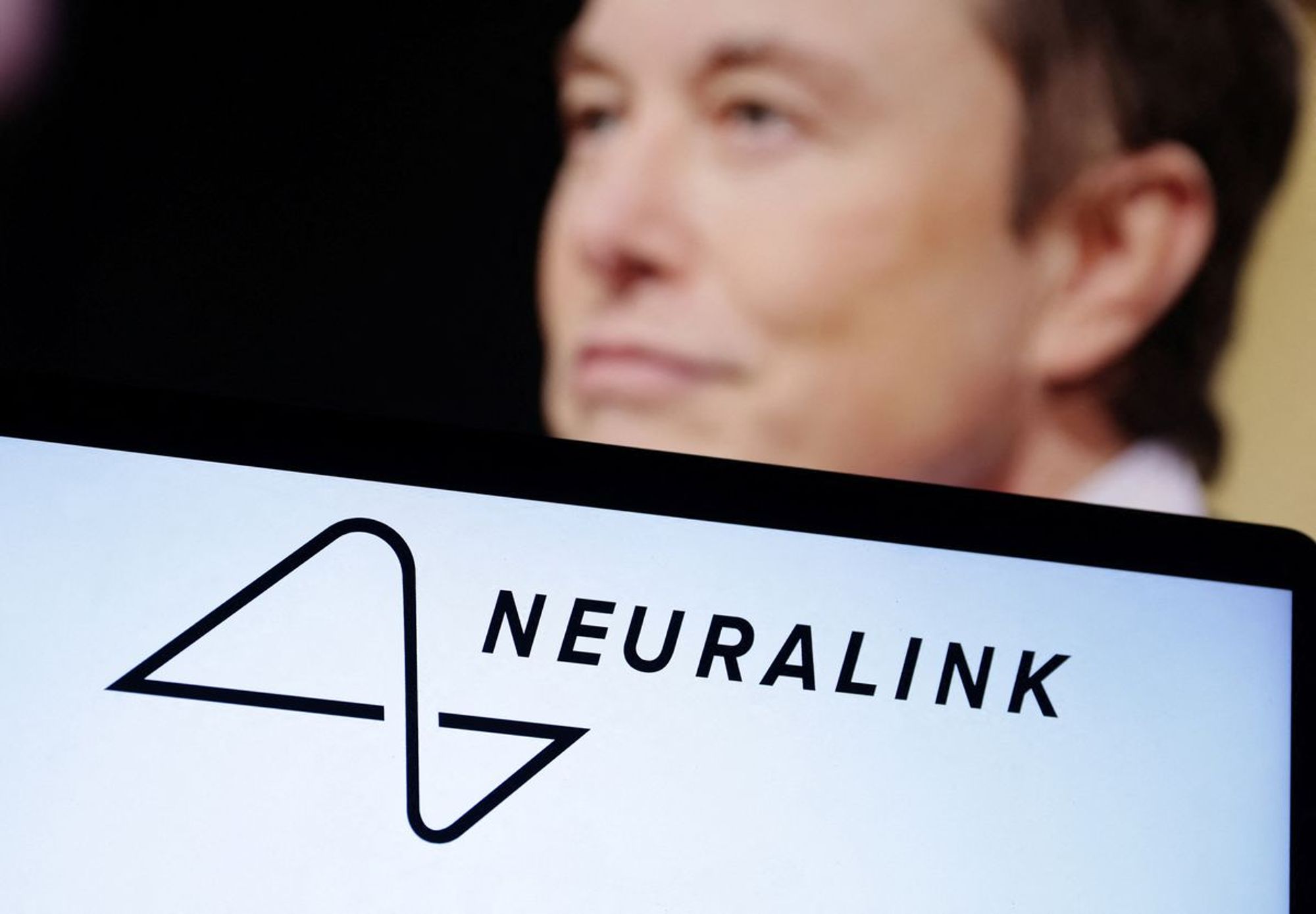 Musk's Neuralink to start human trial of brain implant for paralysis patients | Reuters