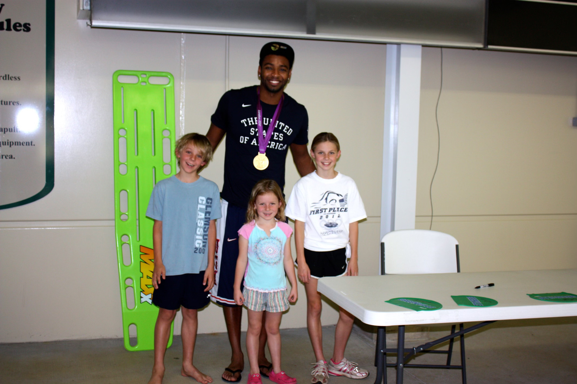 Cara and her siblings with Cullen Jones - an Olympic swimmer & one of her biggest inspirations.