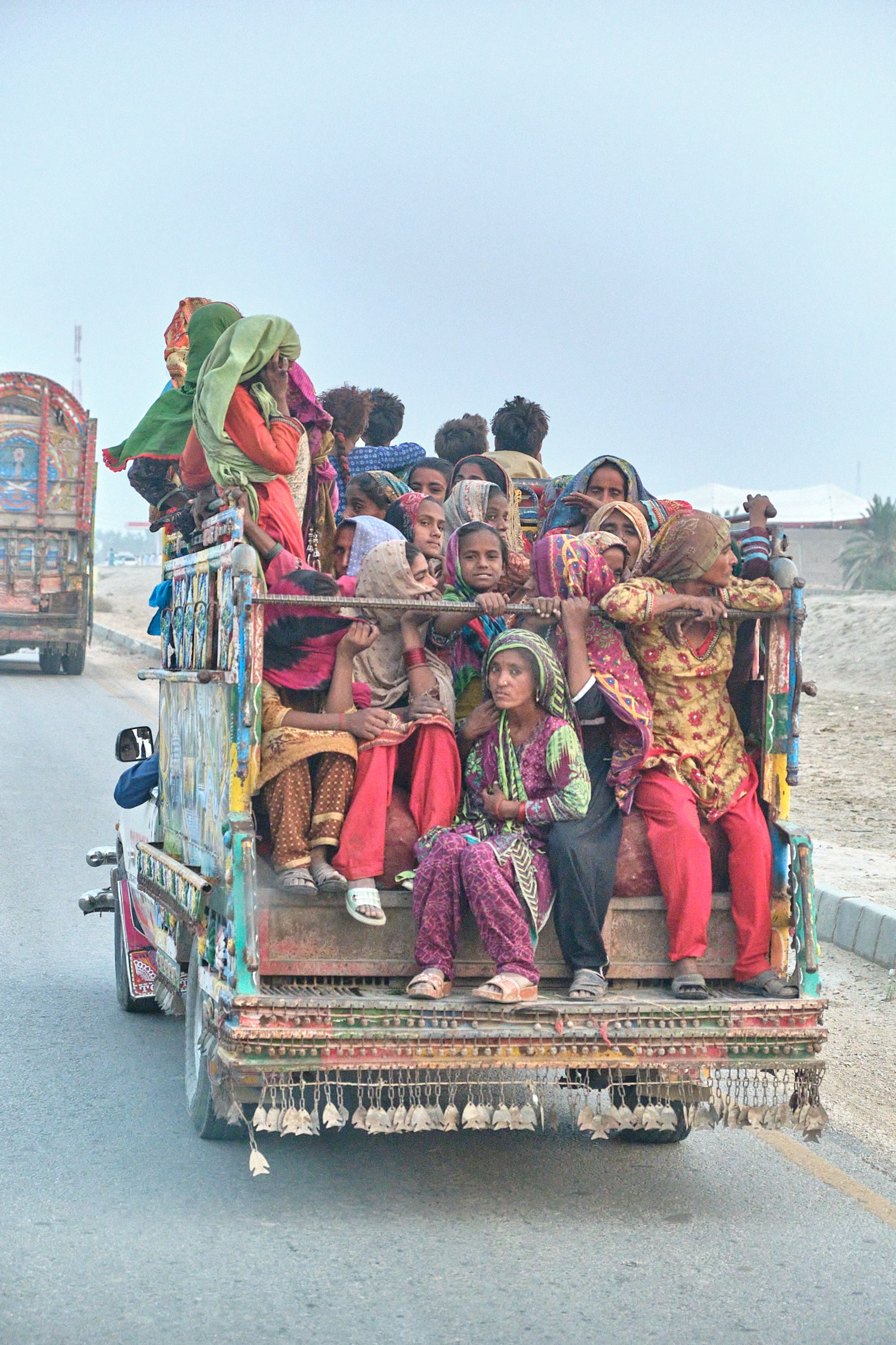 A group of girls and women on a truck