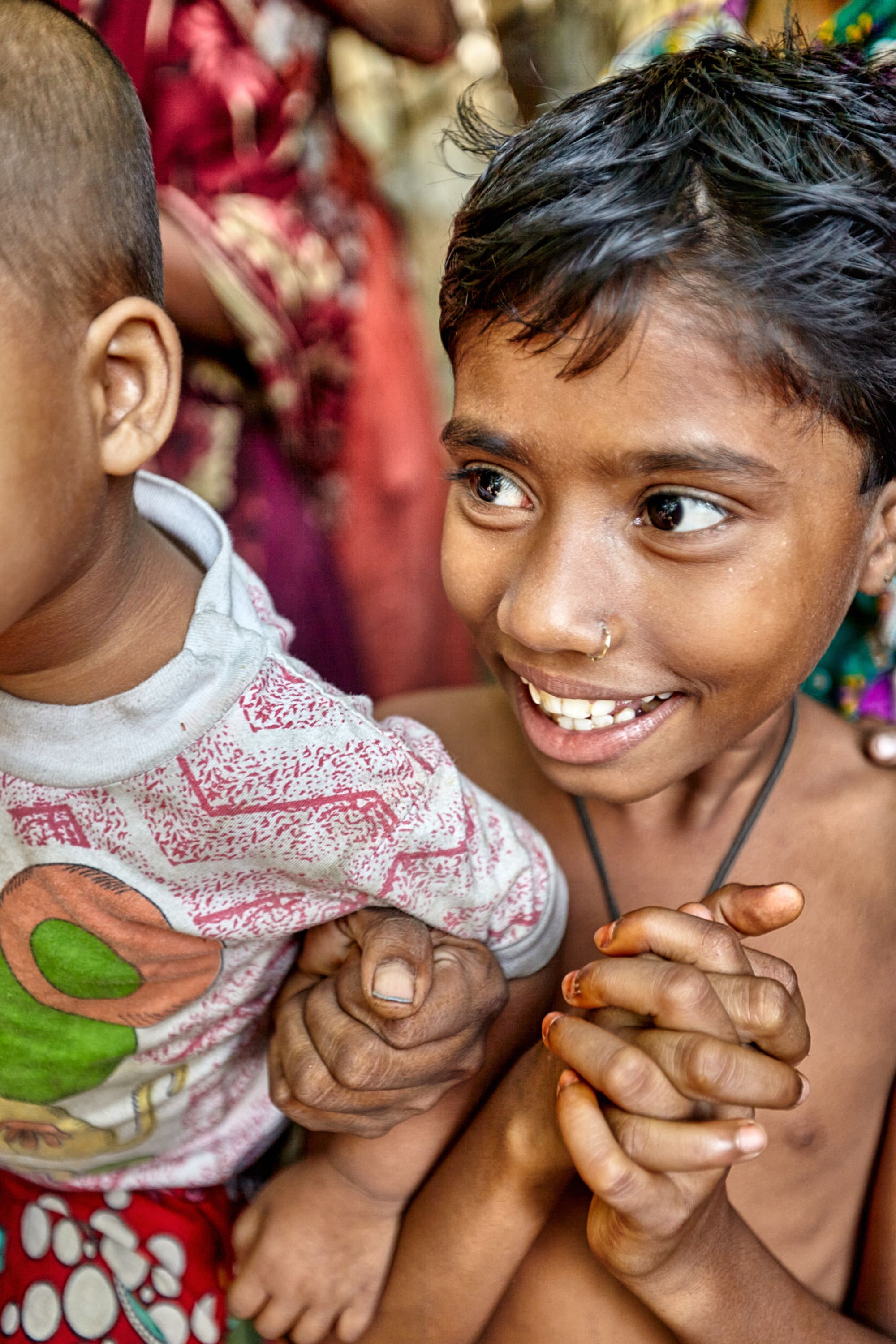 Close-up shot of two children in a rural Bangladesh 