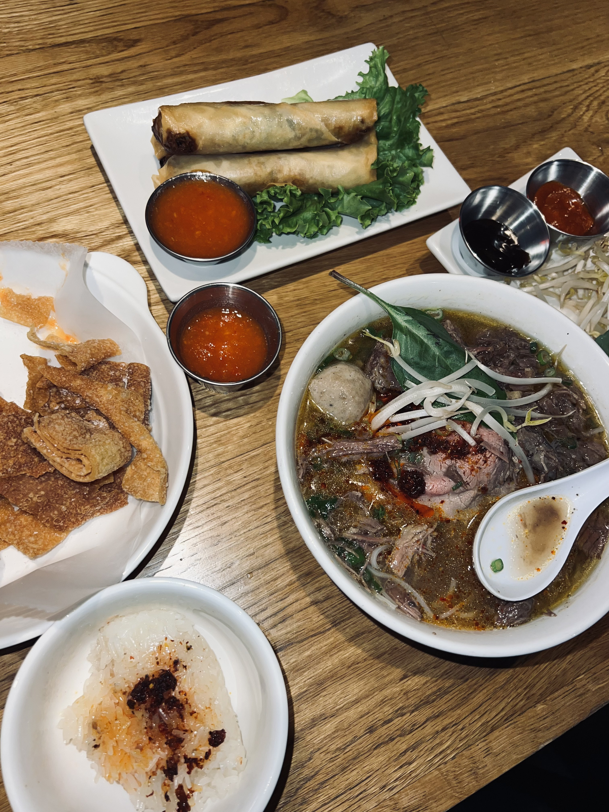 Beef pho, egg rolls, and sticky rice from So So Fed