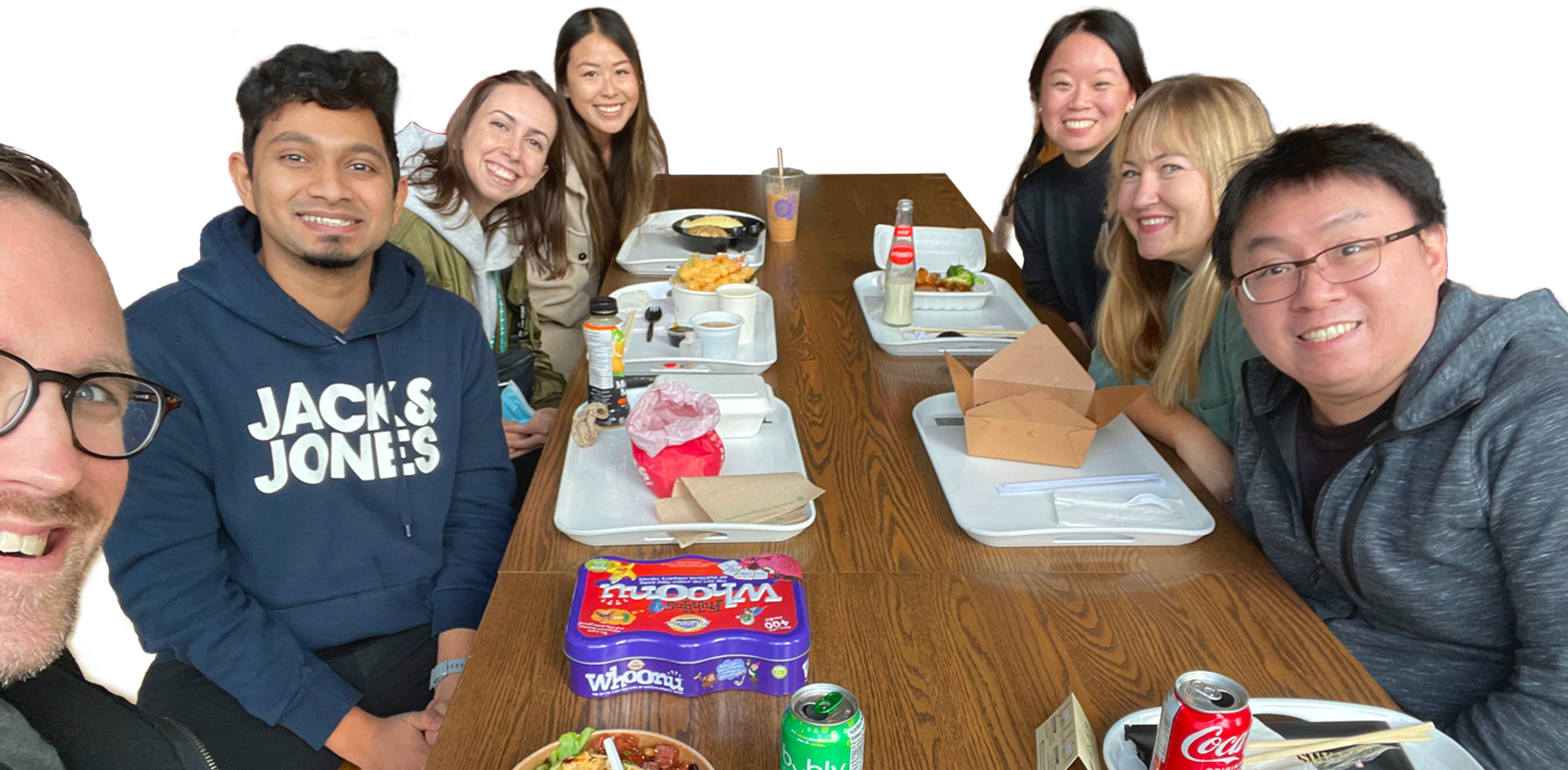 Photo of our design team having lunch and playing games together