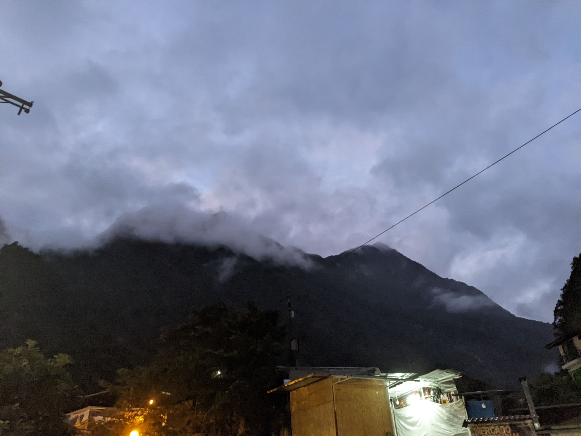 Clouds creeping below the mountains at dawn, the valley of Los Calientes felt very magical at this hour.
