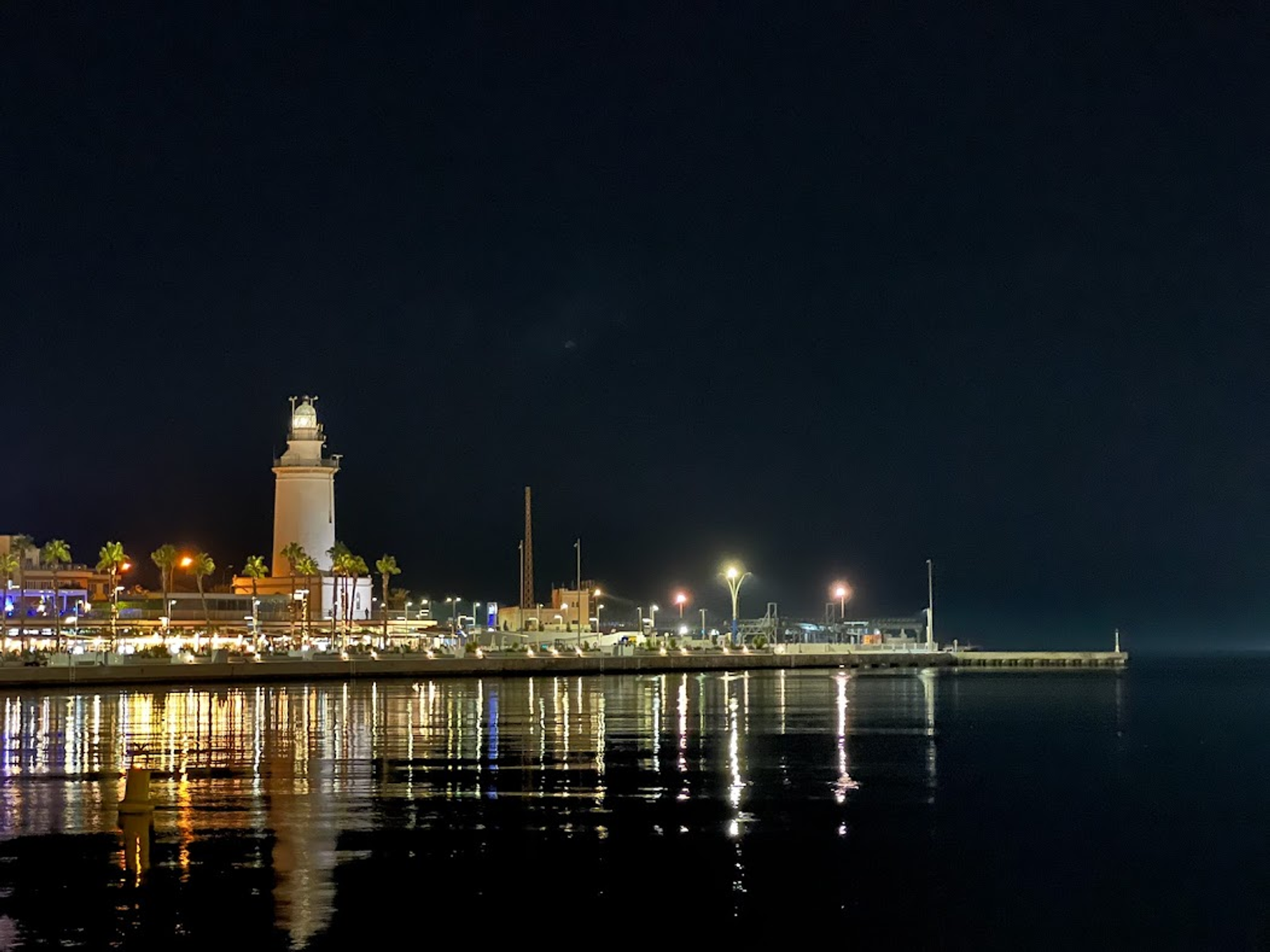 The lighthouse and lights along Muelle Uno